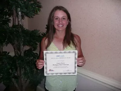 Junior Laura Kueny received her award for being named an honorable mention All-American on Friday night at the NCGA Awards Banquet.