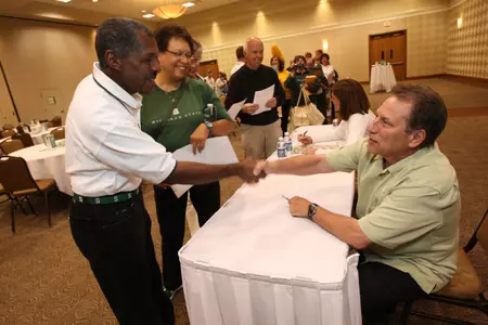 Tom Izzo participates in an autograph signing session at the Coaches on the Road Tour in Novi on Friday.