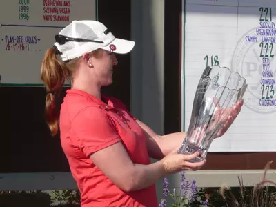 Allison Fouch holds the Michigan Women's Open trophy after winning the tournament on Wednesday.