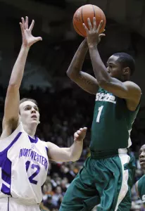 Michigan State's Kalin Lucas, right, shoots over Northwestern's Luka Mirkovic during the first half of an NCAA college men's basketball game in Evanston, Ill., Saturday, Jan. 2, 2010. (AP Photo/Nam Y. Huh)