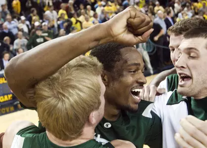 Michigan State guard Kalin Lucas, center, is congratulated by teammates after Michigan State's won 57-56 win over Michigan in an NCAA college basketball game Tuesday, Jan. 26, 2010, in Ann Arbor, Mich. Lucas made a go-ahead jumper with 3.5 seconds left in the game. (AP Photo/Tony Ding)