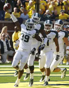 Trenton Robinson intercepted a Denard Robinson pass in the end zone in the first quarter during Saturday's win over Michigan.