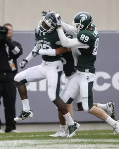 Keshawn Martin celebrates following his punt return for a touchdown.