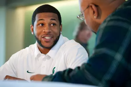 B.J. Cunningham talks with reporters at MSU's Capital One Bowl Media Day.