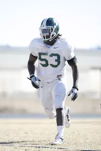 All-American Greg Jones participates in 7-on-7 passing drills during Tuesday's practice at Freedom High School.