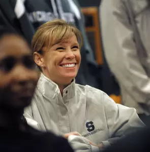 Head coach Suzy Merchant grins after the Spartans were announced as the No. 5 seed in the Kansas City Region. (Photo by Dale G. Young, The Detroit News)