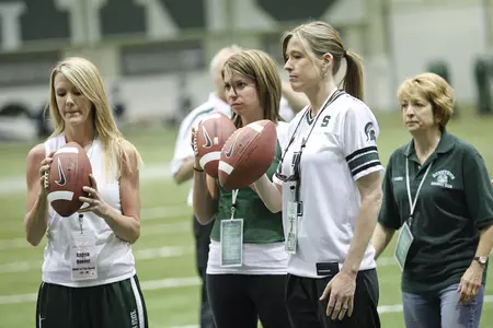 Clinic attendees participate in on-the-field drills with instruction provided by the MSU football coaching staff.