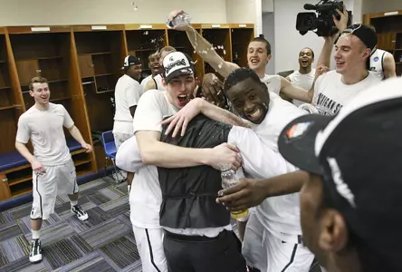 The Spartans celebrate in the locker room following the win over Tennessee.