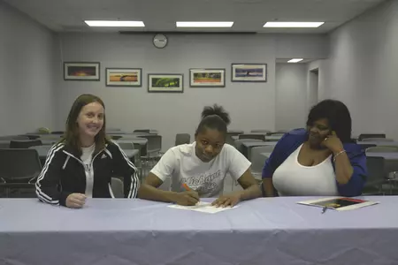 Merrillville senior Bryonna Davis signs her National Letter Intent with Michigan State on Wednesday.