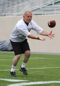 Dick Fullmer catches a pass during Wednesday's Fantasy Camp practice.