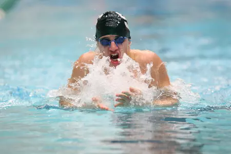 Kevin Puskaric posted an impressive 13th-place finish in the men's 100 breast finals on Tuesday night at the USA Swimming National Championships.
