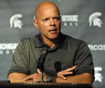 MSU offensive coordinator Don Treadwell addresses the media at Sunday's press conference. (Photo by Dale Young, The Detroit News)