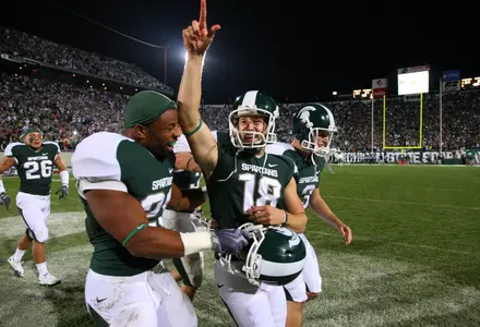 Aaron Bates salutes the crowd following his game-winning touchdown pass against Notre Dame.