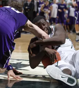 Michigan State's Draymond Green, right, and Northwestern's Davide Curletti battle for a loose ball during the first half. (AP Photo/Al Goldis)