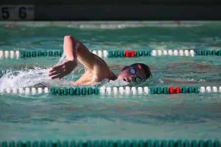 Pat Falconer won the 200-yard freestyle by 0.01 seconds, finishing with a time of 1:40.94.