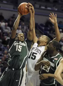 Michigan State's Durrell Summers tries to get a shot off in the first half. (AP Photo/John Beale)