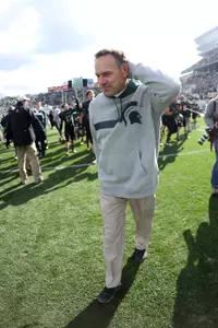 Dantonio smiles as he walks off the field following MSU's 28-14 win over Michigan in Spartan Stadium last Saturday.