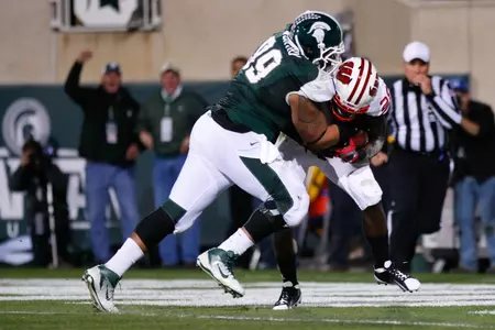 Jerel Worthy wraps up Wisconsin's Montee Ball for a 3-yard loss early in the second quarter.