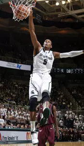 Adreian Payne dunks during the second half of MSU's 69-47 win over UALR.