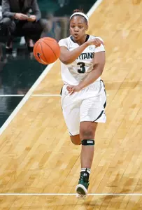 Porsche Poole passes the ball up the court during a fast-break. Poole finished with 13 points.