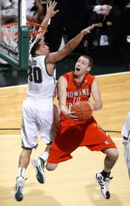 Bowling Green's Scott Thomas, right, puts up a layup against Michigan State's Brandon Wood. (AP Photo/Al Goldis)