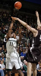 Michigan State's Keith Appling shoots against Lehigh's Conroy Baltimore, right, during the first half. (AP Photo/Al Goldis)