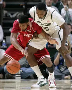 Indiana's Christian Watford, left, and Michigan State's Derrick Nix battle for the ball during the first half. (AP Photo/Al Goldis)