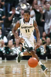 Keith Appling looks to pass.