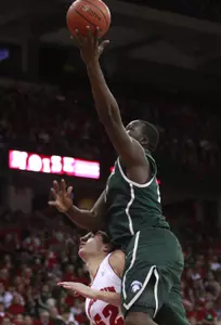 Michigan State's Draymond Green, top, shoots over Wisconsin's Keaton Nankivil.