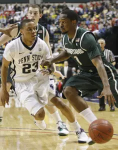 Michigan State guard Kalin Lucas (1) drives the ball against Penn State guard Tim Frazier (23).