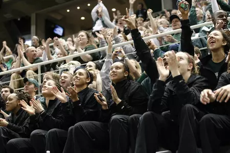 Brittney Thomas and Kalisha Keane watch as the Spartans are announced as a No. 4 seed in the Dallas Region.