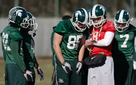 Kirk Cousins and the Spartans practiced for the first time this spring on Tuesday.