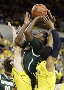 Kalin Lucas takes a shot in traffic in the first half.