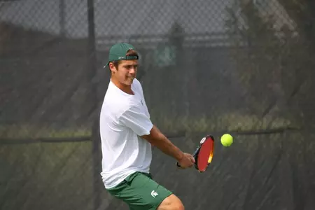 Freshman Aaron Pfister earned both a singles and doubles victory vs. the Badgers