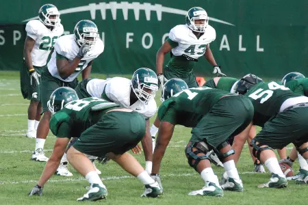 Freshman linebacker Lawrence Thomas and his classmates took one-third of the reps in Tuesday's practice in shells.