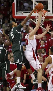 Michigan State's Adreian Payne blocks a shot by Wisconsin's Jared Berggren during the first half. (AP Photo/Andy Manis)