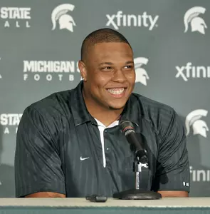Jerel Worthy smiles at a press conference at MSU's Clara Bell Smith Center in East Lansing. (Dale G. Young / Detroit News)