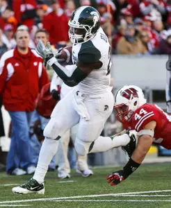 Le'Veon Bell runs past Wisconsin linebacker Chris Borland. Bell finished with 106 all-purpose yards and one touchdown.