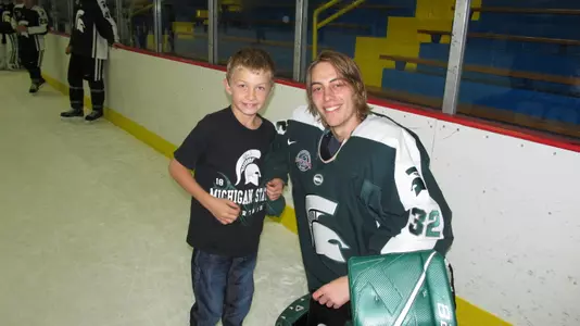 Nate Phillips poses with a young Spartan fan