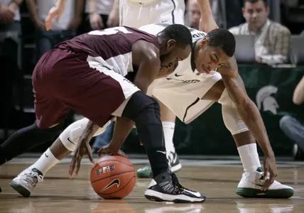 Keith Appling vies for a loose ball.