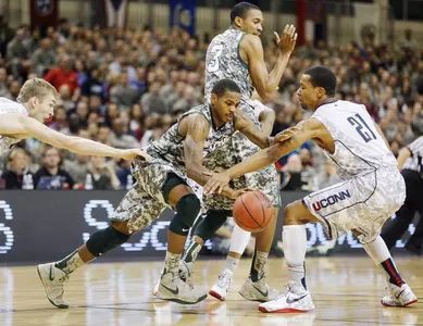Keith Appling drives against Connecticut.