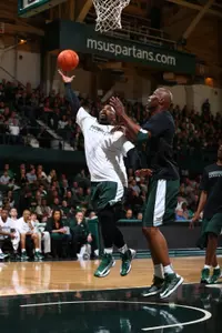 Mateen Cleaves converts a layup despite being fouled by Kevin Willis.