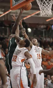 Branden Dawson passes over Bowling Green's defenders.