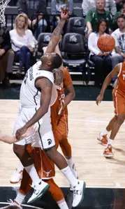 Michigan State's Derrick Nix and Texas' Connor Lammert compete for a rebound during the first half. (AP Photo/Al Goldis)