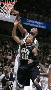 Branden Dawson blocks a shot by Arkansas-Pine Bluff's Lazabian Jackson.