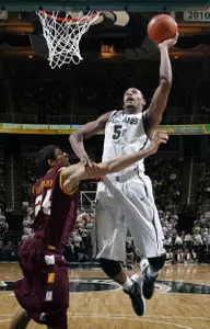Adreian Payne shoots against Loyola's Ben Averkamp.