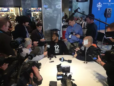 B.J. Cunningham speaks with reporters at the NFL Combine in Indianapolis.