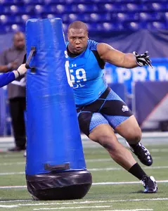 Jerel Worthy works out at the NFL Combine on Monday at Lucas Oil Stadium.