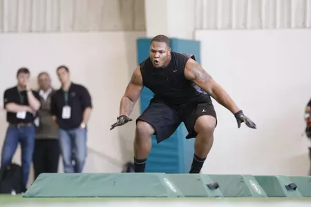 Jerel Worthy performs in the defensive line drills at MSU's Pro Day on Wednesday.