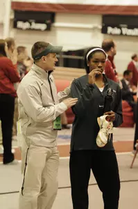 Assistant Coach Chris Bostwick with Tori Franklin who placed second in the triple jump at the Big Ten Indoor Championships.